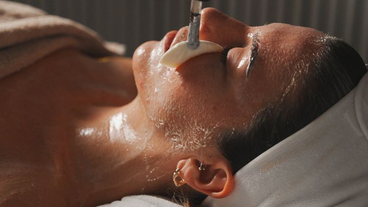 Skincare preparation during an in-clinic appointment