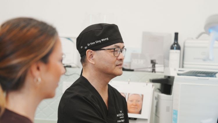 Dr Wong speaking with a patient in the clinic