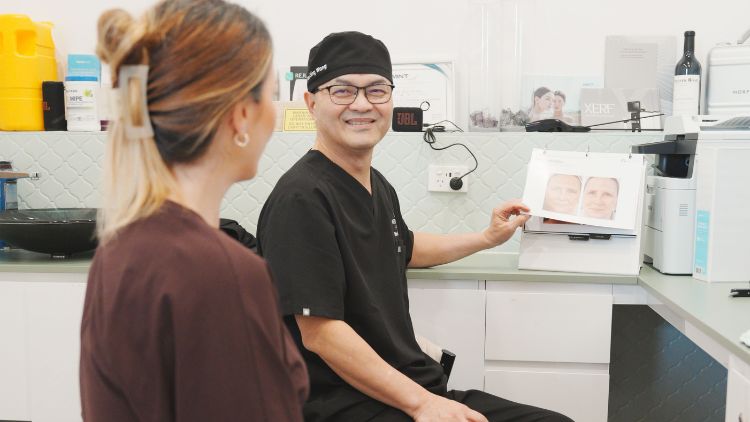 Dr Wong discussing skin findings and follow-up with a patient