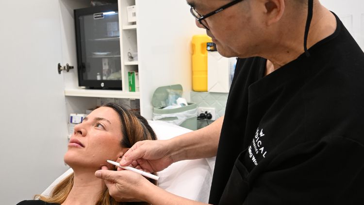 Dr Wong marking a lower-face treatment area