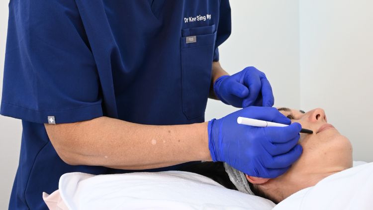 Dr Wong marking a treatment area