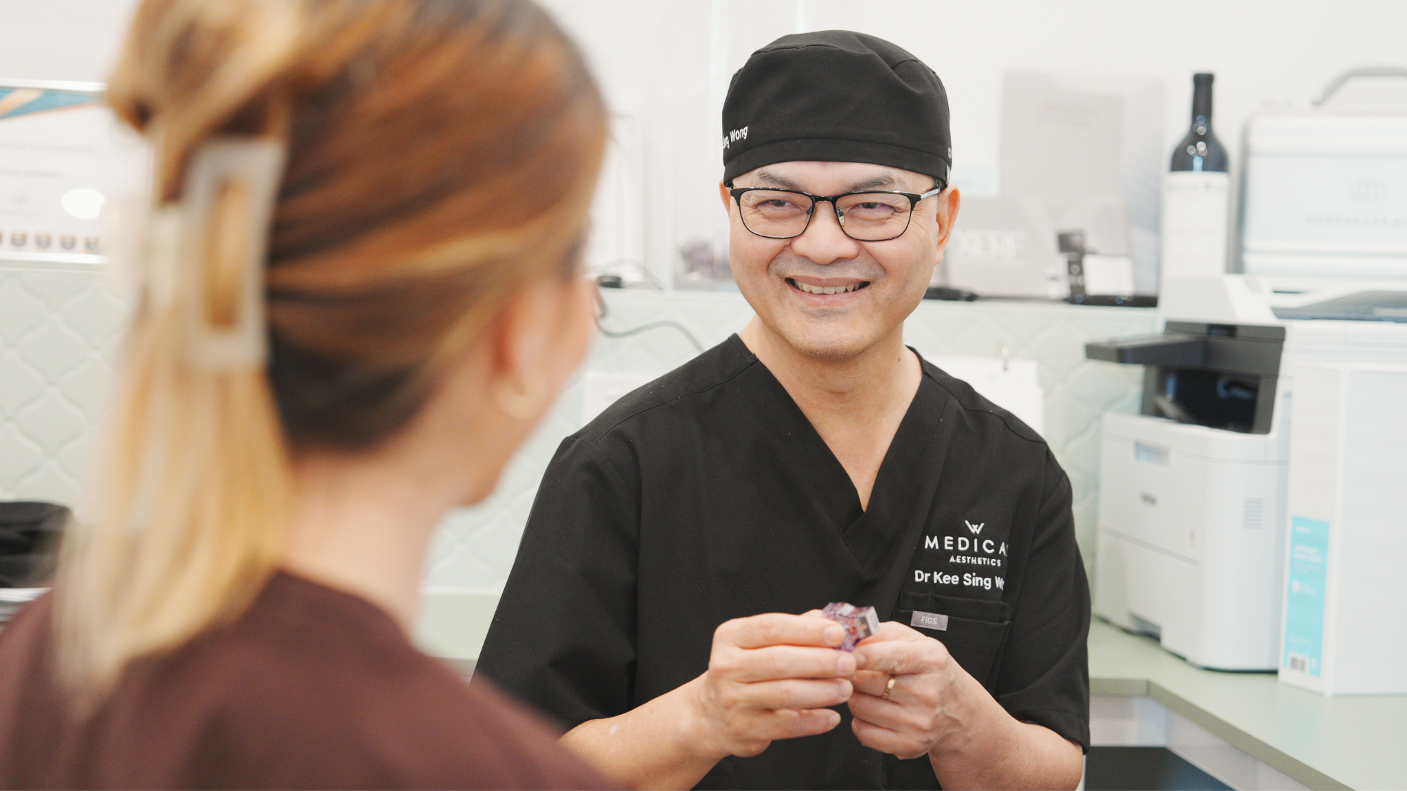 Dr Wong discussing a personalised treatment plan