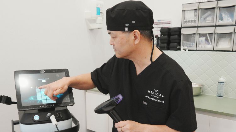 Dr Wong explaining treatment equipment