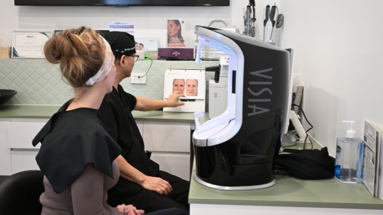 Dr Wong reviewing facial skin imaging