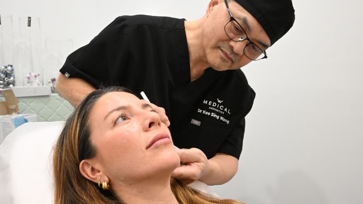 Dr Wong assessing the lower face and jawline