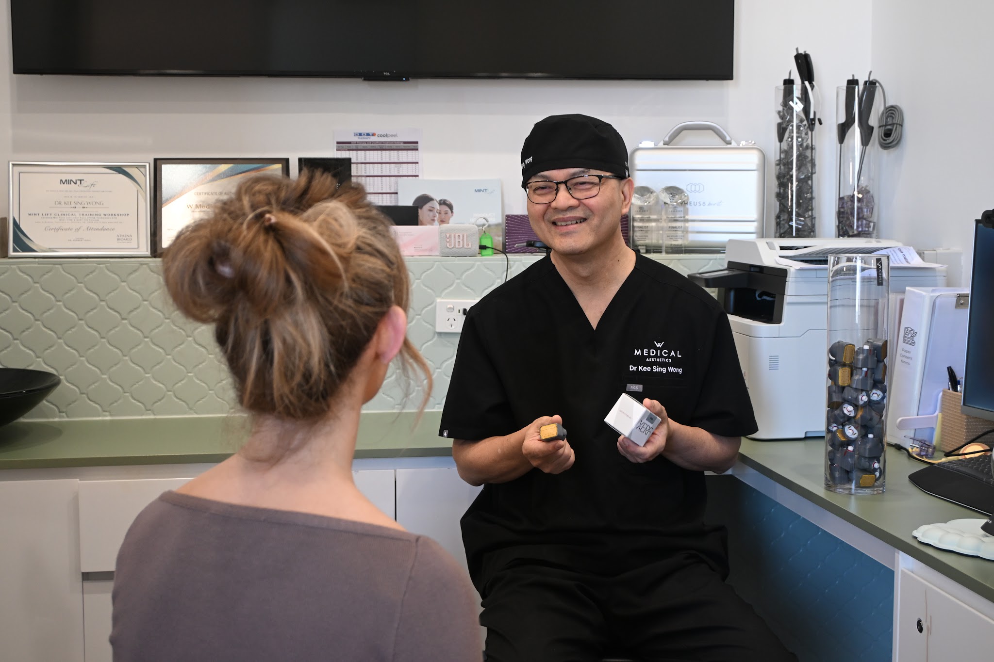Dr Wong discussing skin assessment